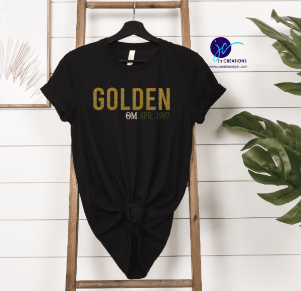 A black t shirt that says golden and all the best