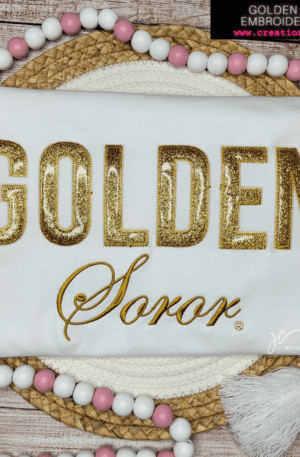 A white shirt with the word golden soror on it.