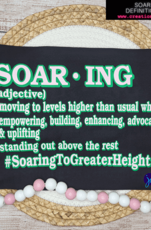 A black and green t-shirt with the word soaring on it.