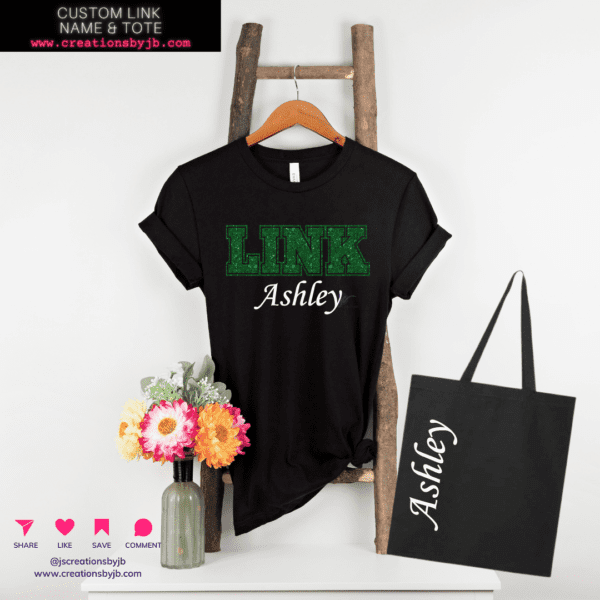 A black t-shirt that says link ashley on it.