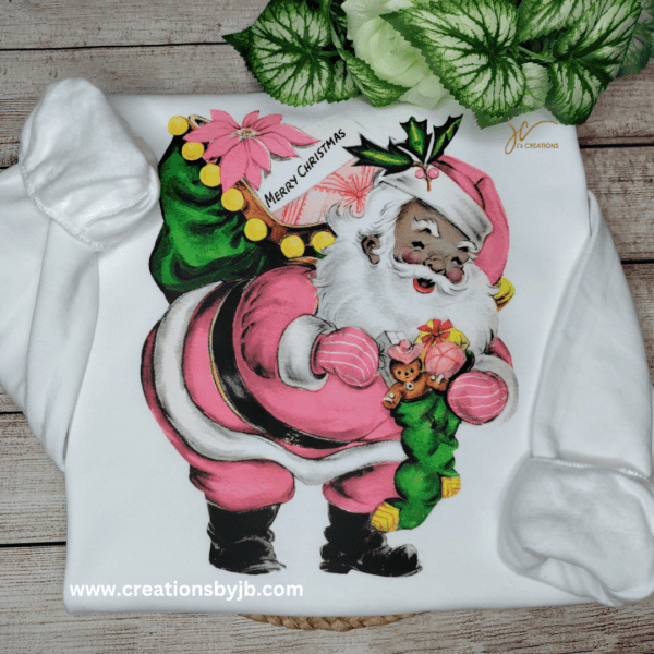 A painting of santa claus on the back of a shirt.