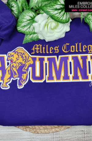 A purple sweatshirt with the name of miles college alumni on it.