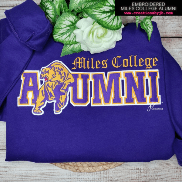 A purple sweatshirt with the name of miles college alumni on it.