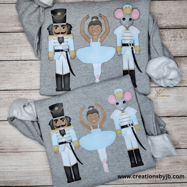 Two nutcracker shirts with a mouse and ballerina on them.