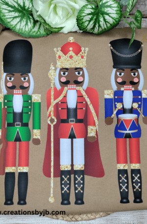 Three nutcrackers are painted on a brown shirt.