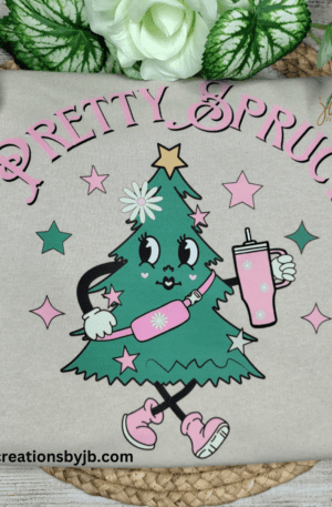 A christmas tree with pink and green decorations.