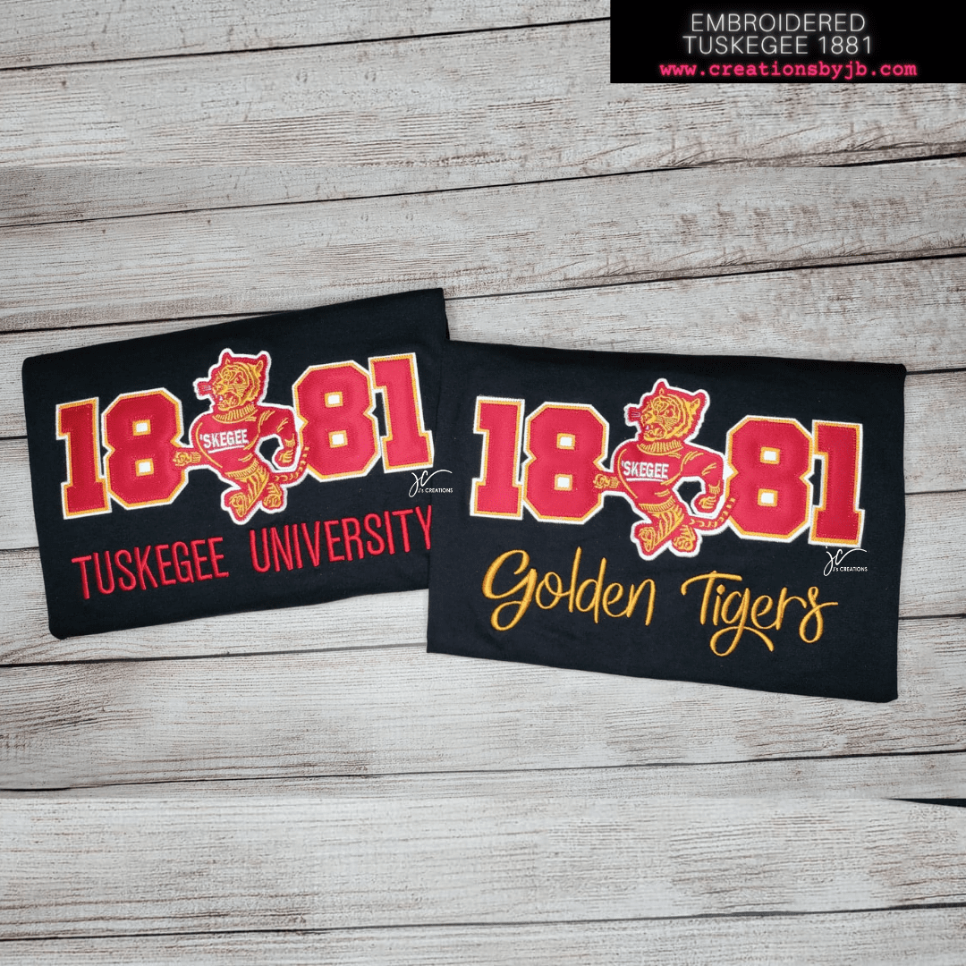 A pair of magnets with the words " 1 8 8 1 tuskegee university " and golden tigers.