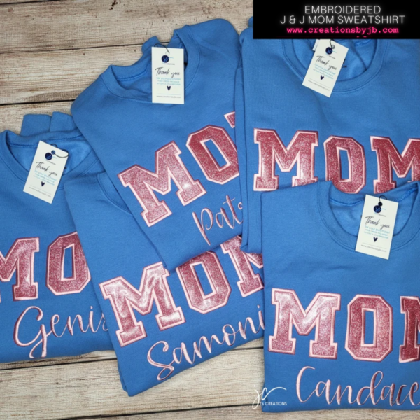 A group of four shirts that say mom and the name of each one.