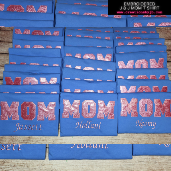A pile of blue boxes with pink writing on them.
